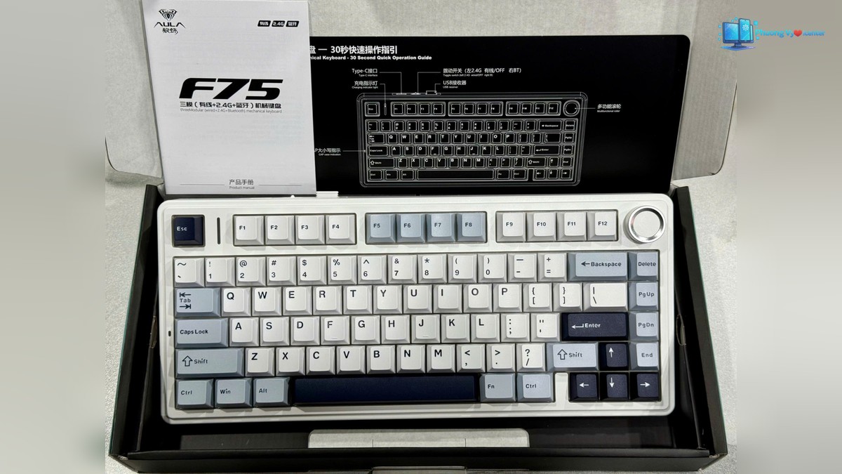 AULA F75 Pro nằm trong hộp mở, phía trên có sách hướng dẫn và hình bố trí phím