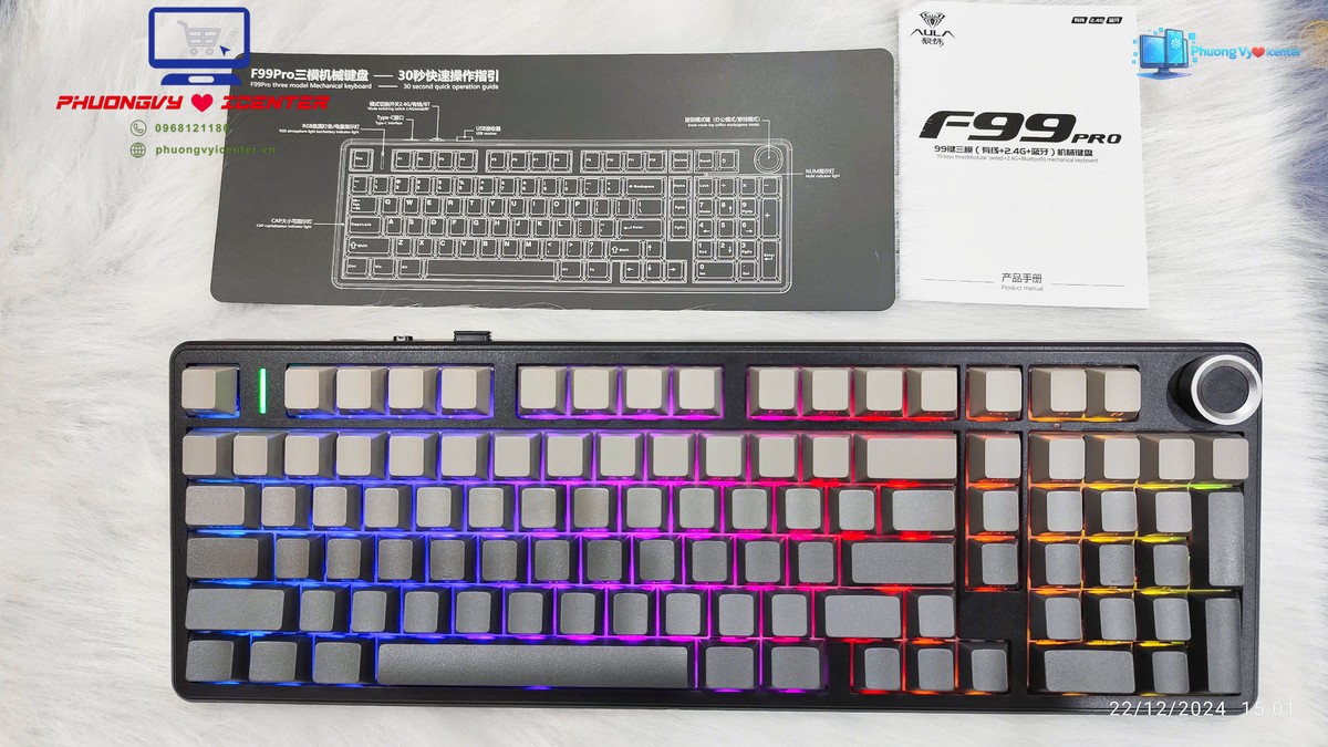 AULA F99 Pro V2 nhìn từ trên với đèn RGB nhiều màu và tài liệu hướng dẫn phía trên